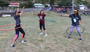 Seniors Shannon Domingsil and Janelle Medrano (far right) try to outlast junior Frances Nicole Tabios in displaying their hula hoop talents.