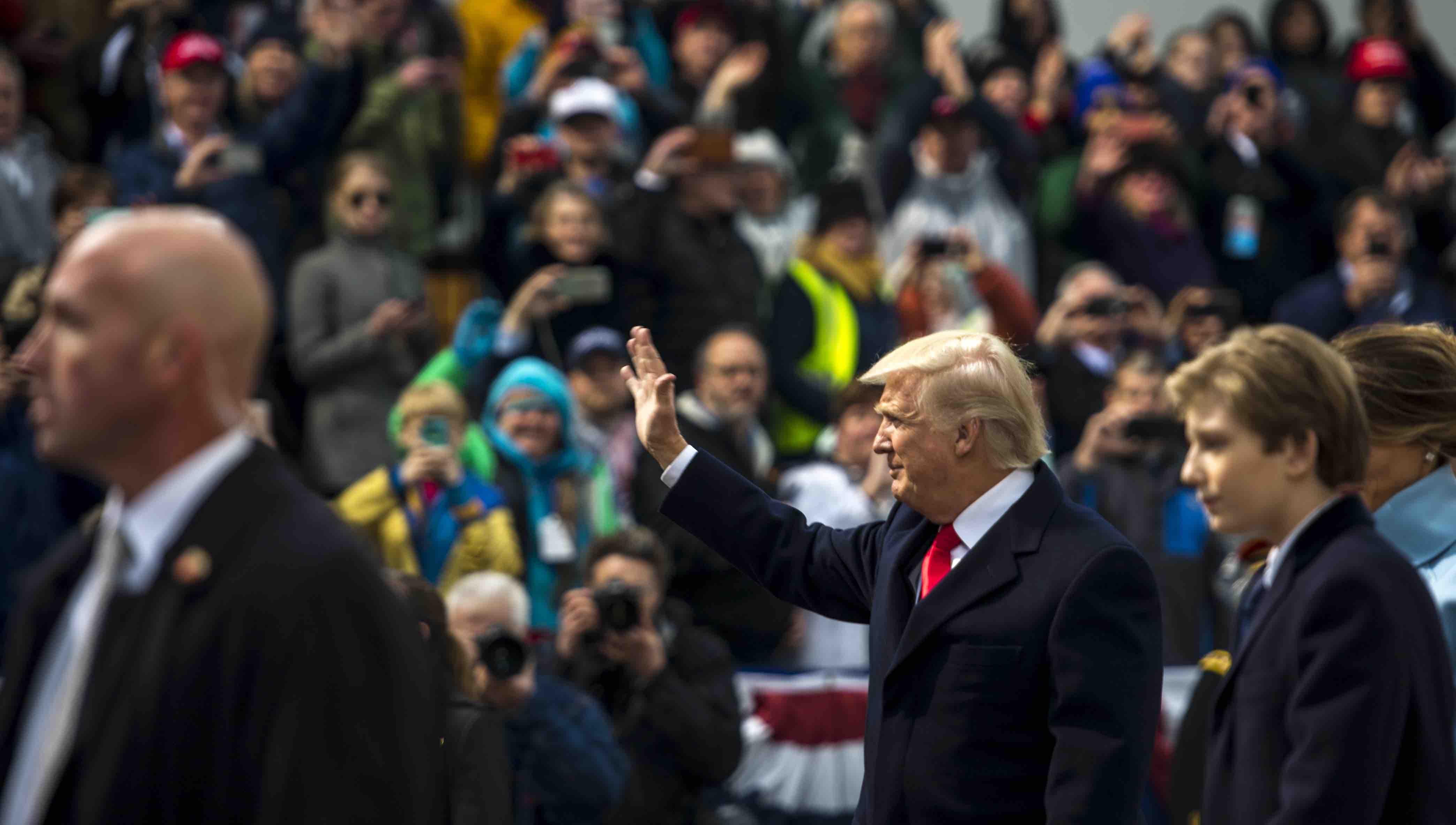 U.S. President Donald J. Trump waves at the spectators during the 58th Presidential Inauguration parade in Washington, D.C., Jan. 20, 2017. More than 5,000 military members from across all branches of the armed forces of the United States, including reserve and National Guard components, provided ceremonial support and Defense Support of Civil Authorities during the inaugural period. (DoD photo by U.S. Air Force Staff Sgt. Marianique Santos)