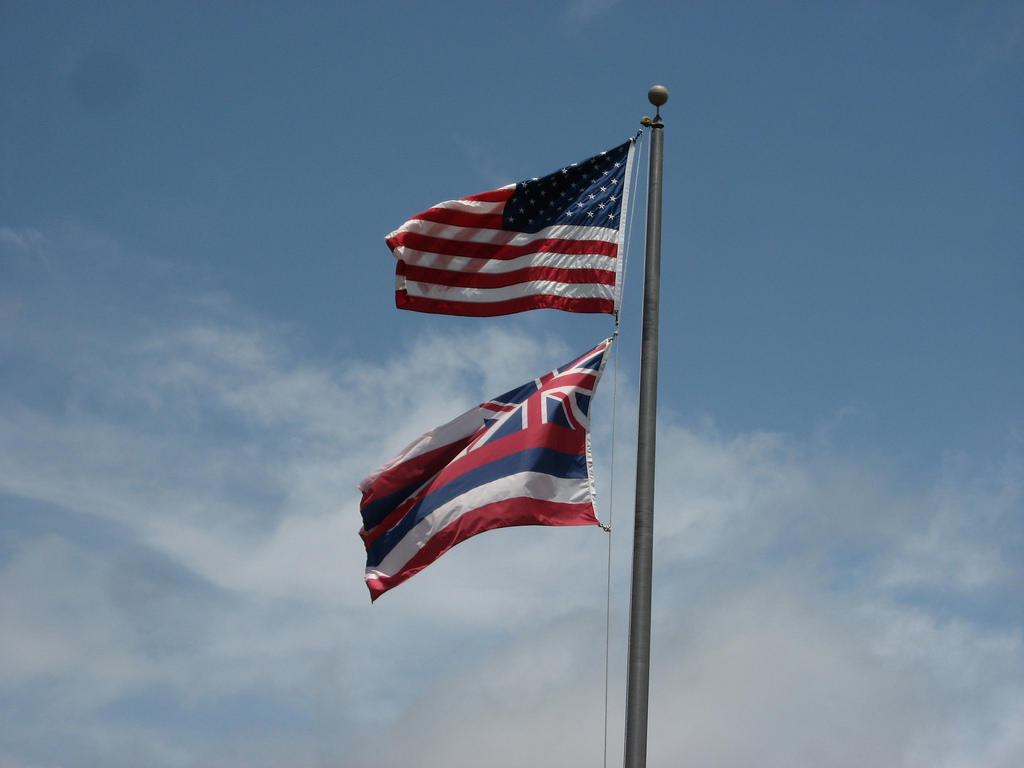 The law regarding how the Hawaiian flag should be flown underneath the National flag when on a single flagpole has been a debated topic for many years and protesters are looking for a change. Photo courtesy of Flickr.