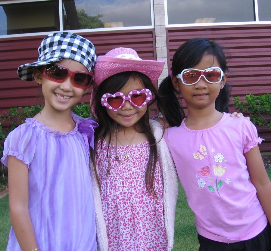 Elementary students Zandrina Cambra, Nina Kawamura and Katie Lynn enjoy a dress down day for Scholarships