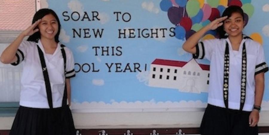 Student council president Angela Wong and vice-president Caroline Kikkawa salute the new year. The theme for the school year is Soaring to New Heights.