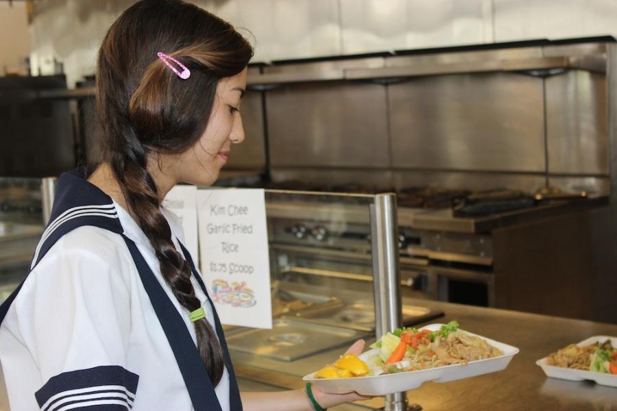 The student cafeterias hot lunches follow federal guidelines for healthy lunches, yet many students choose items from the a la carte menu.