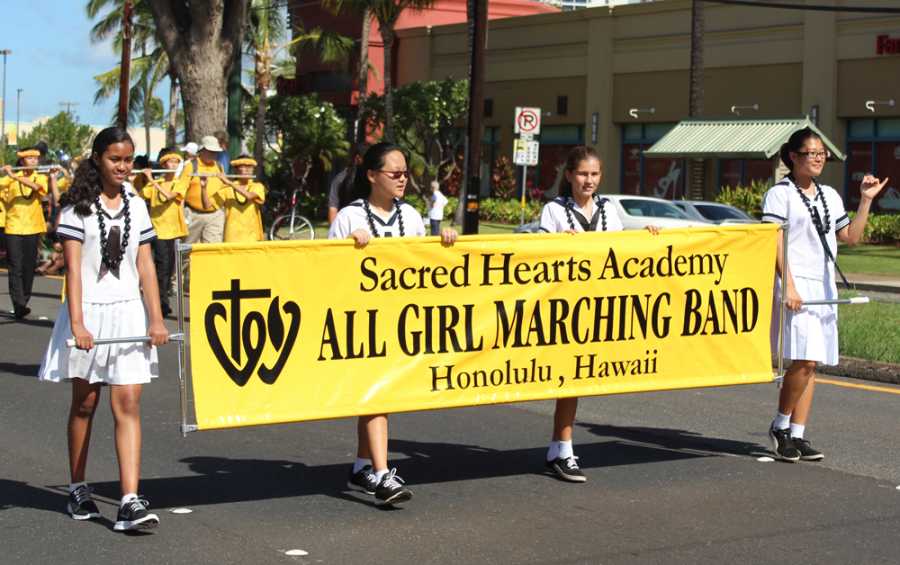 The Lancer marching band paraded through Waikiki In the 67th Annual Aloha Festivals Floral Parade under the direction of band director Keith Higaki.