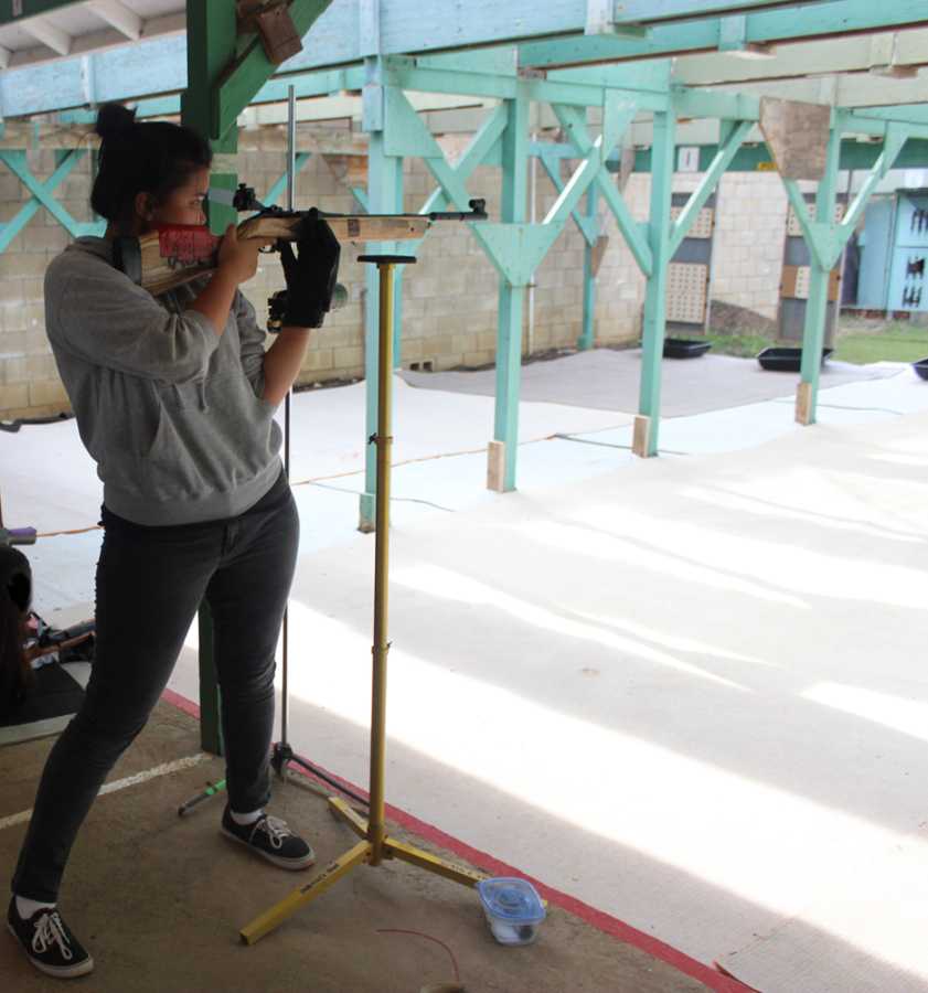 Athletes, such as air riflery shooter Danielle Ho, maintain good grades despite the demands of sports and extracurricular activities.