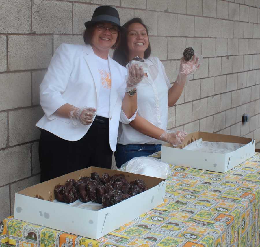 Student Council adviser, Toni Normand, and spirit head, Jaclyn Sakamoto, distributed poi doughnuts to students during Spirit Week. 