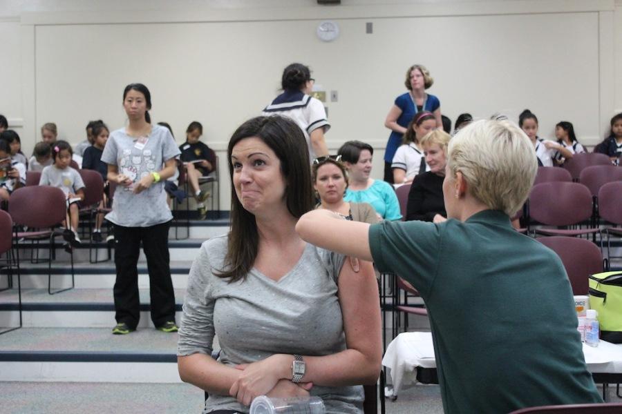 The annual flu clinic saw more than 300 students and teachers, including Kimberlee Brown, vaccinated against the flu.