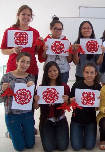 Academy students made paper cut-outs of flower designs and butterflies with students of Hwa Nan Womens College during their China trip.