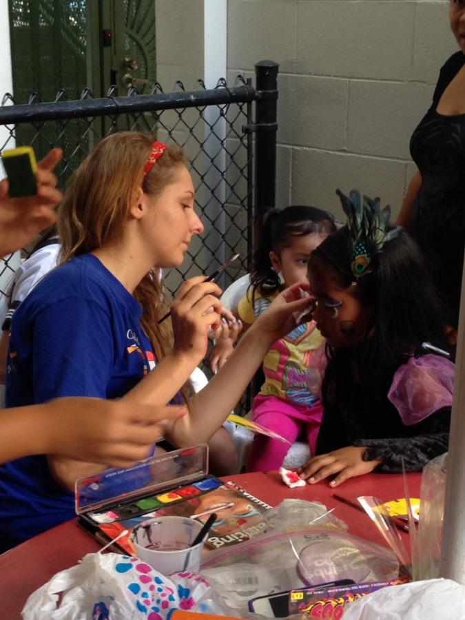 Junior Megan Balinowski did body painting at Loliana Hale where OUR club celebrated Halloween with families.