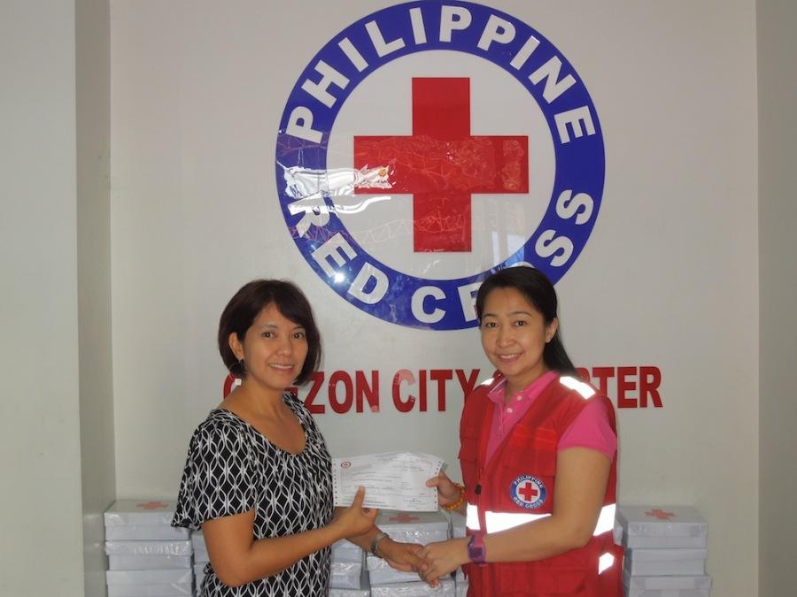 Junior Kindergarten teacher, Sandra Arnobit, delivered the check from the Academy fundraiser, Operation Haiyan, to Red Cross officials in the Philippines during the Christmas break.