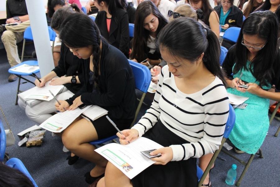 Juniors Pamela Lee and Tiffany Nakama­Fukuhara work on a monthly budget to see how much they earned and spent in the session, Personal Finance.