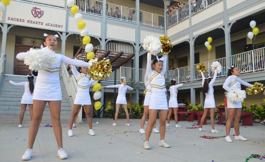 The Academys cheerleaders demonstrate school spirit on the Academys birthday.
Photographer: Jacquelyn Corpus.