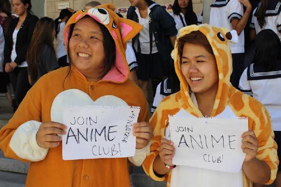Juniors Kelly Zhang and Angie Mara display their enthusiasm for Anime Club at last year’s Club Fair.