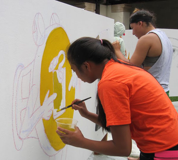 Sophomore Kaycee Selga and junior Jessica Hanashiro helped create a mural encouraging public awareness of Fire Prevention Week.