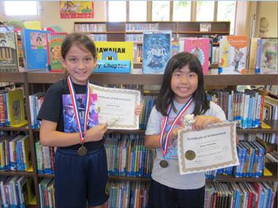 “Third graders Sabrina Kopf and Keira Iwamoto are two of 91 students who reached their reading goals every month this school year.”