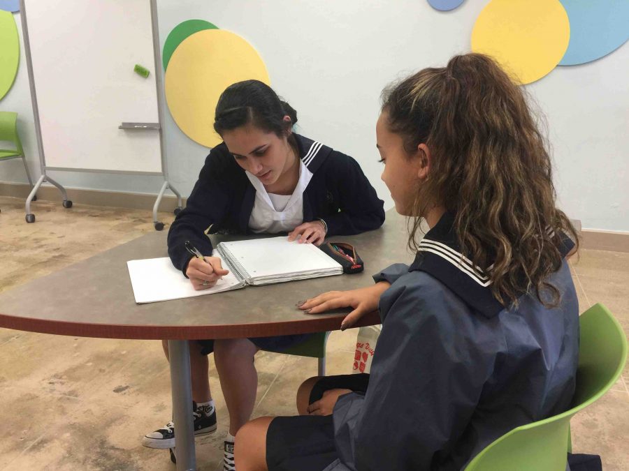 Senior Chloe Ponimoi works with freshman Hunter-Bailey Kaimikaua during after-school NHS tutoring.