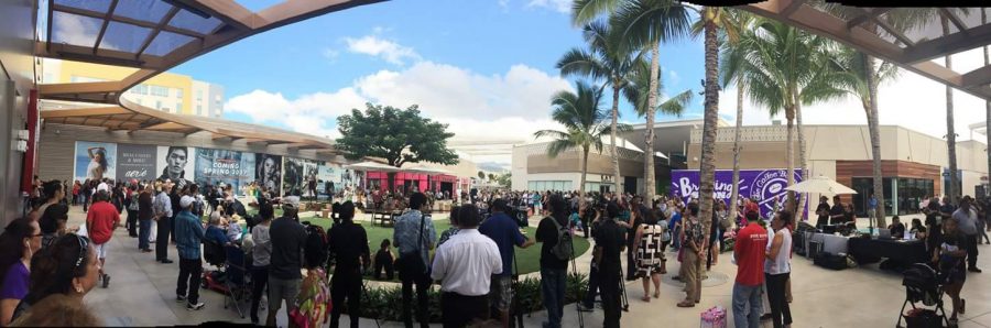 Shoppers watching a center stage performance during the grand opening of Ka Makana Alii shopping mall in Kapolei.