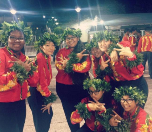 Marching band students don the aloha print uniforms that will be worn in the Macy’s Thanksgiving Day Parade.