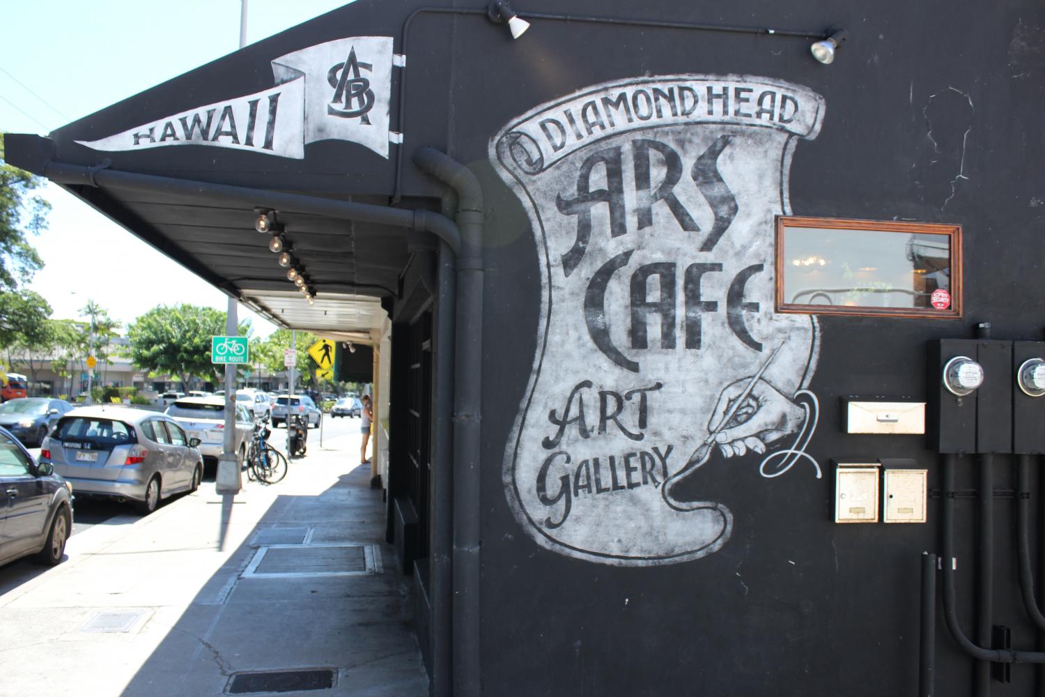 A white on black canvas on the left of the entrance to Ars Cafe. Photos by Jasmine Matsumoto.