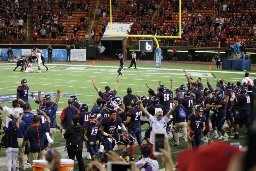 The+Saint+Louis+Crusaders%2C+along+with+fans%2C+celebrate+their+victory+over+Kahuku.+All+photos+courtesy+of+Melanie+Constantino.