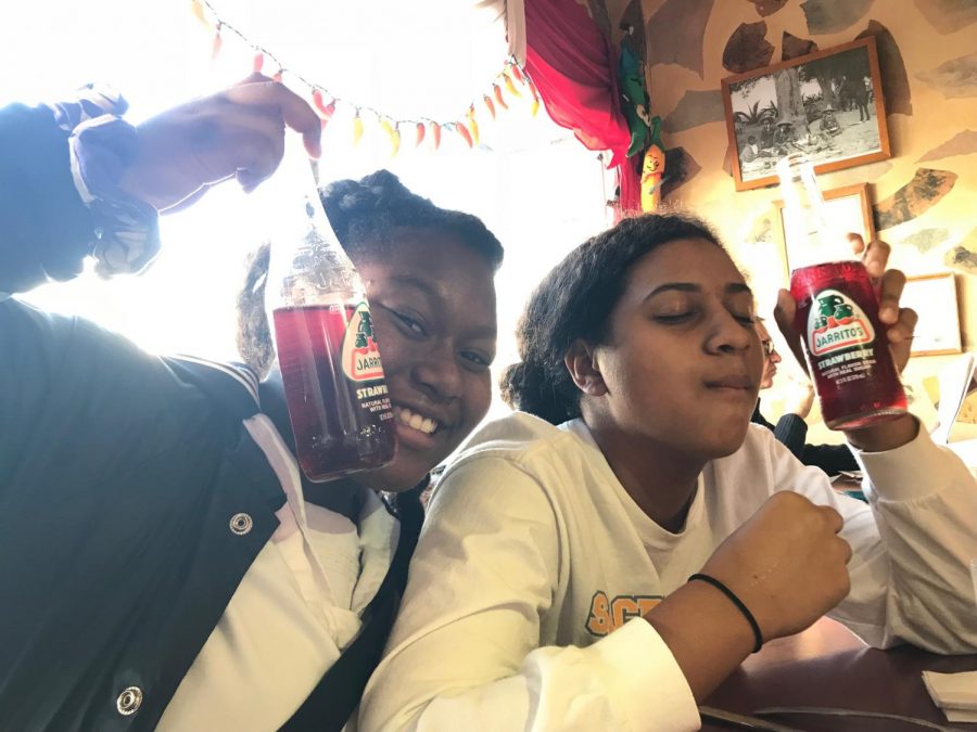Sophomores Destiny Carter and EjaLee Chavis  share a strawberry soda from Mexican restaurant Aztec. Photo by Noe Nekotani.
