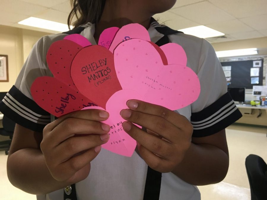 Students started their day with a sweet start when they received heart shaped notes and candies from their friends. Photo by Shelby Mattos. 
