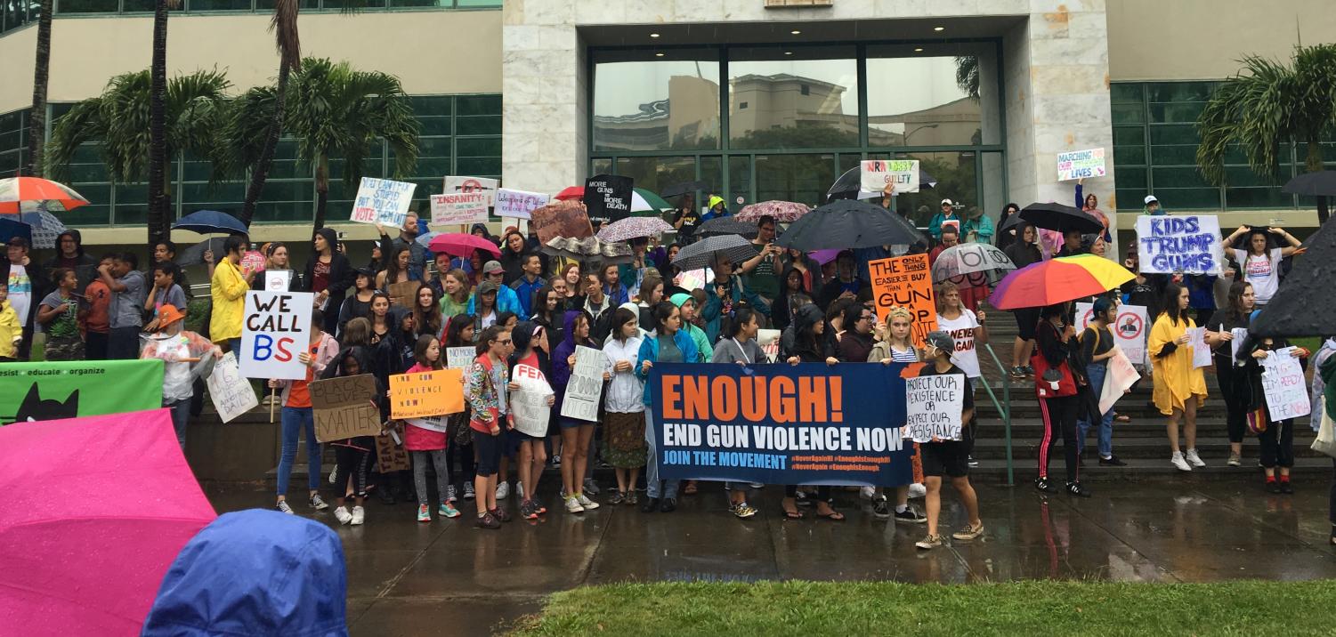 On March 24, students from across the nation came together to protest gun violence and the lack of gun control in the United States of America. In Hawaii, students stopped for a photo in front of the Department of Education main office. Photos by Taylor McKenzie. 
