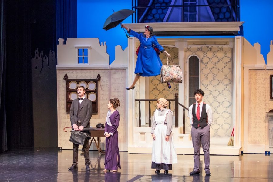 Academy senior Kira Stone soars above the cast, as she makes her entrance as Mary Poppins. The musical is a stage adaptation of the classic Disney movie, Mary Poppins, and features students from both the Academy and Saint Louis Schools. Photo by Shay Bonilla.