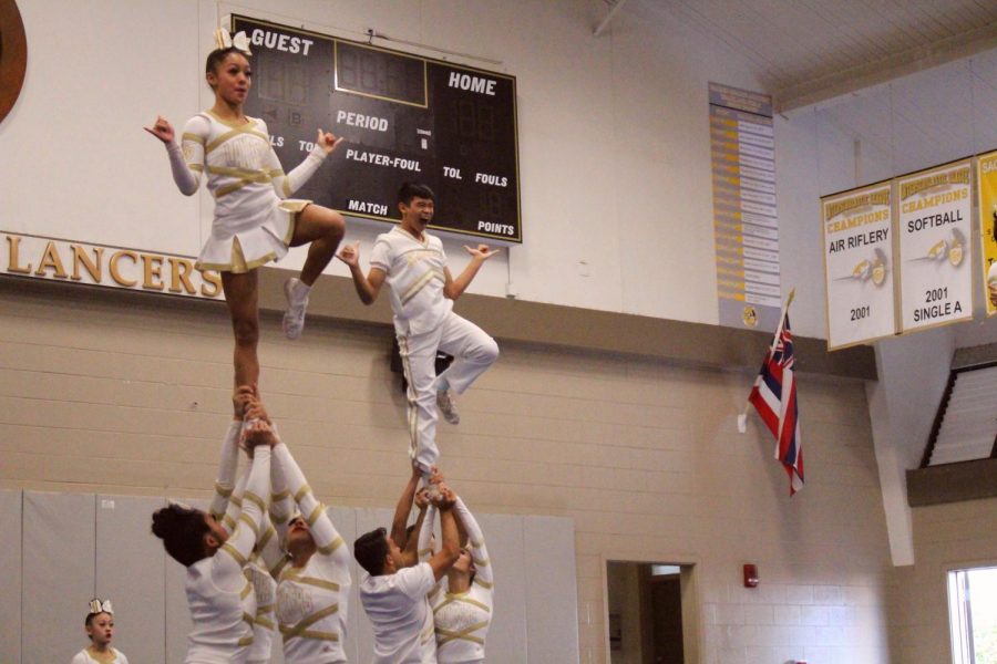 The Crusader and Lancer team show off their winning routine at a pep rally on the Academy campus last week. They won their second national title this year. All photos by Mercedes Anacleto.