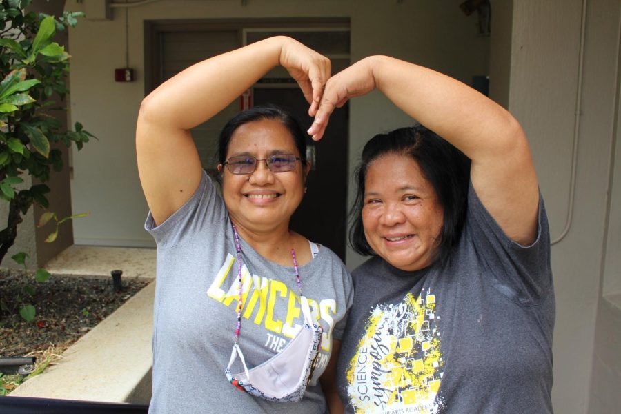(Left to right) Housekeeping staff Josie Narciso and Joanne Calaycay show off their charm by making a heart. Both met years ago when they taught at Saint Anthony School. All photos by Kathleen Burgos. 