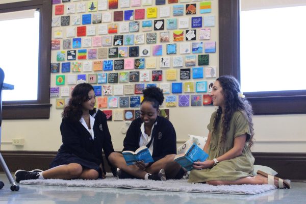 English teacher Katie Gaitan (right) expresses her love for famous playwright Shakespeare with students Kaiulani Ferrer (left) and Malaika Ssebayiteko (middle). Photo by Zaneya Caires.