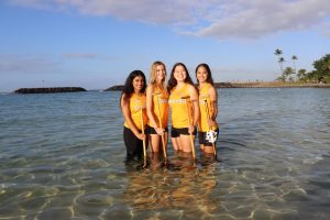 Sacred Heart Academy seniors hold their paddles tight in the waters of Magic Island. (From Left to Right) Senior Veda Gang, Anna Pinkerton, Madison Iwashita, and Charli Omura. Photo courtesy to Mahina Monsarrat Ohelo.