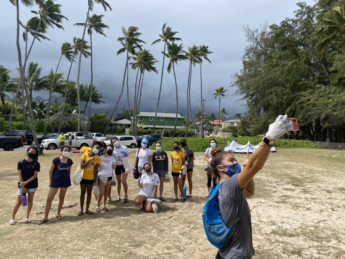 Club members pose during a beach cleanup in 2021. This year, the club will host similar activities. 