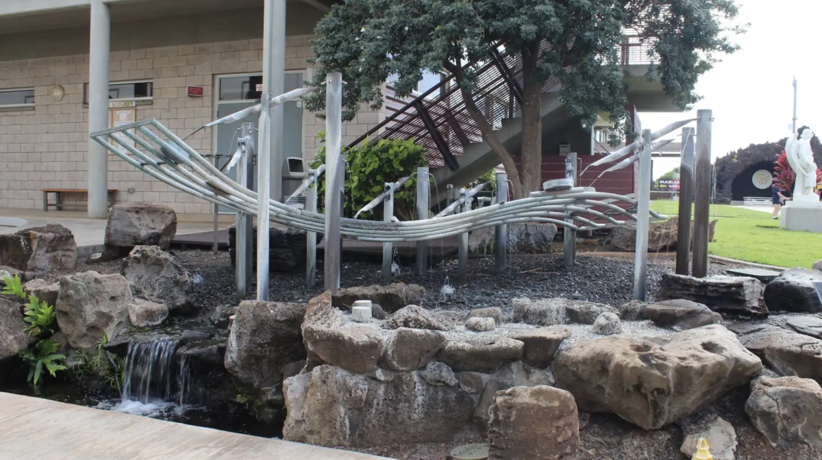 The Pu’ukani fountain sits on top of gravel, with the water from its musical chimes creating a small waterfall. It is located in front of the Performing Arts Center. All photos by Chloe Wolfert.