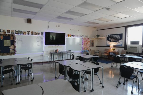 This is a photo of Theology teacher Steffanie Beissel’s new classroom. Beissel placed a sofa in her classroom, and students love to relax there. Photo by Ann Li.
