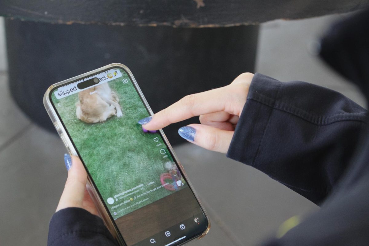 Sophomore Yong Xuan Li scrolling through a short video on Instagram. She is working on limiting her screen time, using Instagram for less than one hour daily. Photo by Gennellea Amasol.