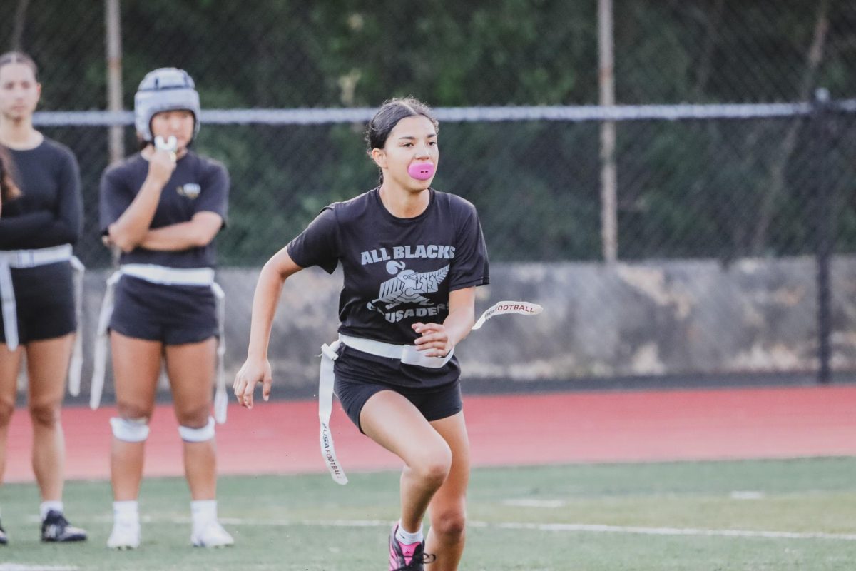Academy sophomore Joy Gora-Aina works on drills during practice. She says she looks forward to representing not only her school but also girls in this inaugural season of flag football.