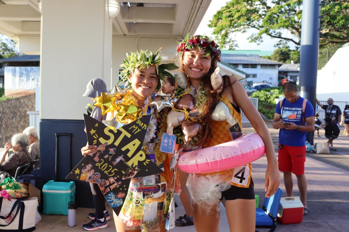 Academy seniors Starlen Wong and Angelina Lind celebrating their senior night after competing in the ILH trials track meet.