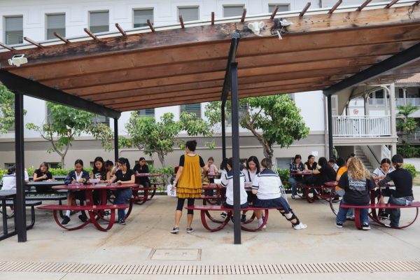 Japanese language teacher Nami Grafia took her students outside during the power outage. Without air conditioning, many classrooms quickly became uncomfortably hot, teachers said.