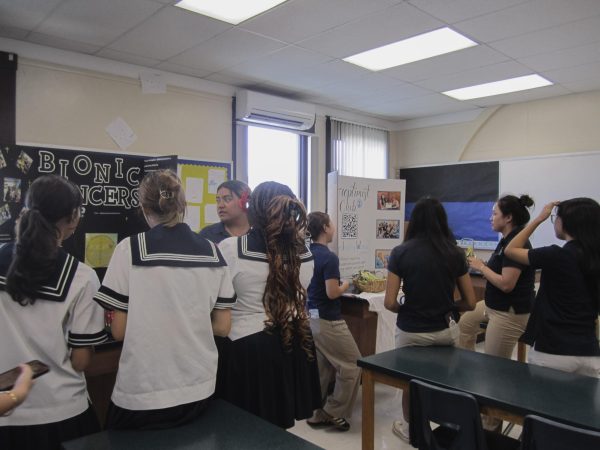 BIONIC Lancer member and senior Destiny Tautofi talks to students who are interested joining the club. The club is focused on spreading kindness. 