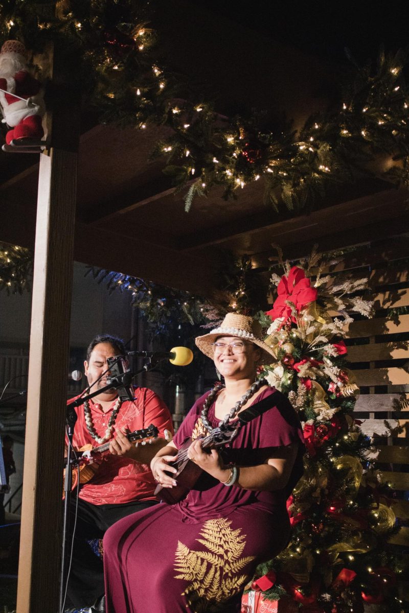 Local musicians performed holiday mele throughout the evening, providing live music that carried across the campus and drew community members toward the center of the event. Their performances blended traditional Hawaiian songs with familiar Christmas melodies, creating a musical backdrop that reflected both cultural traditions and the holiday season.