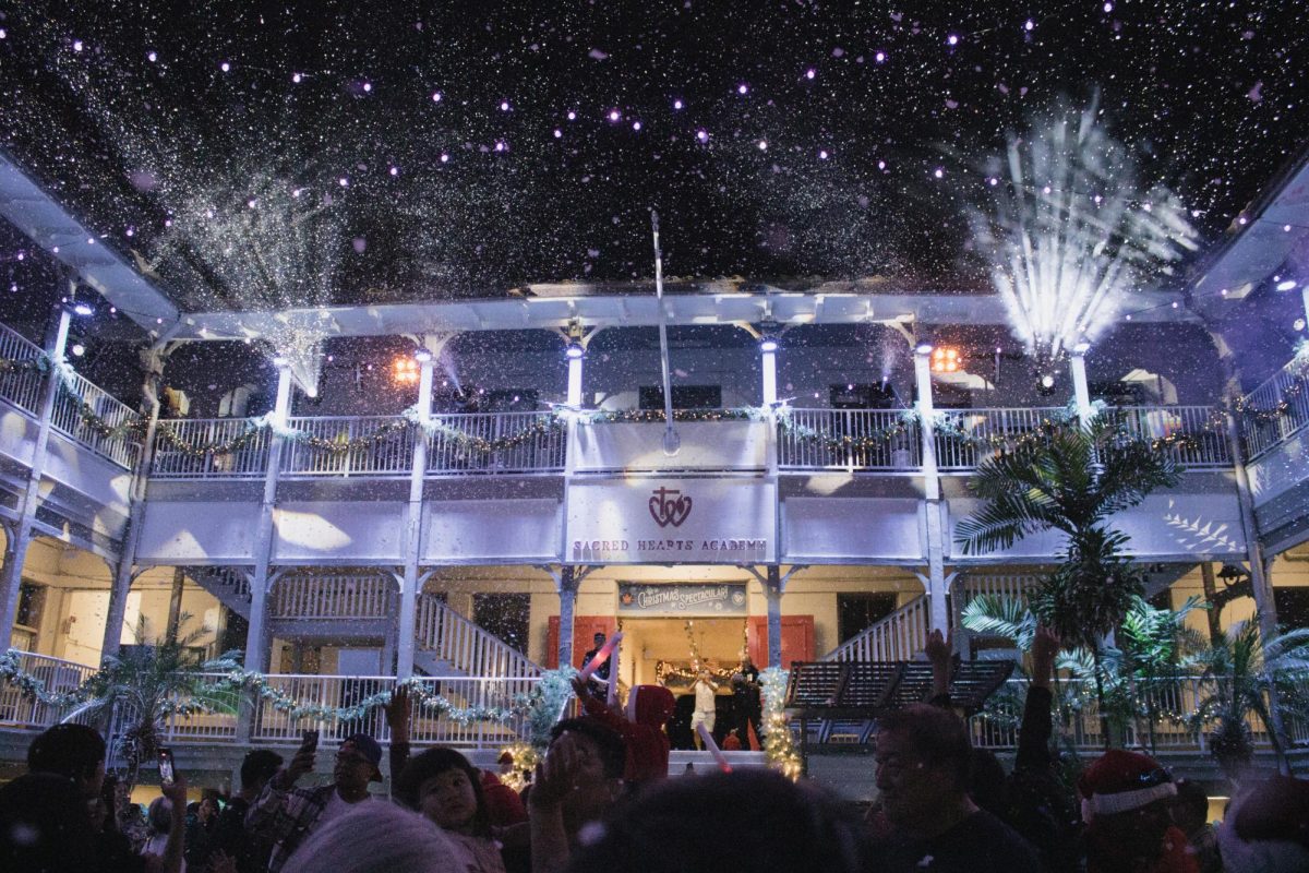 The crowd moved toward the main courtyard for the evening’s final event, gathering beneath the lights in anticipation of the snow and light show. Families, students and community members filled the space as the program prepared to conclude.