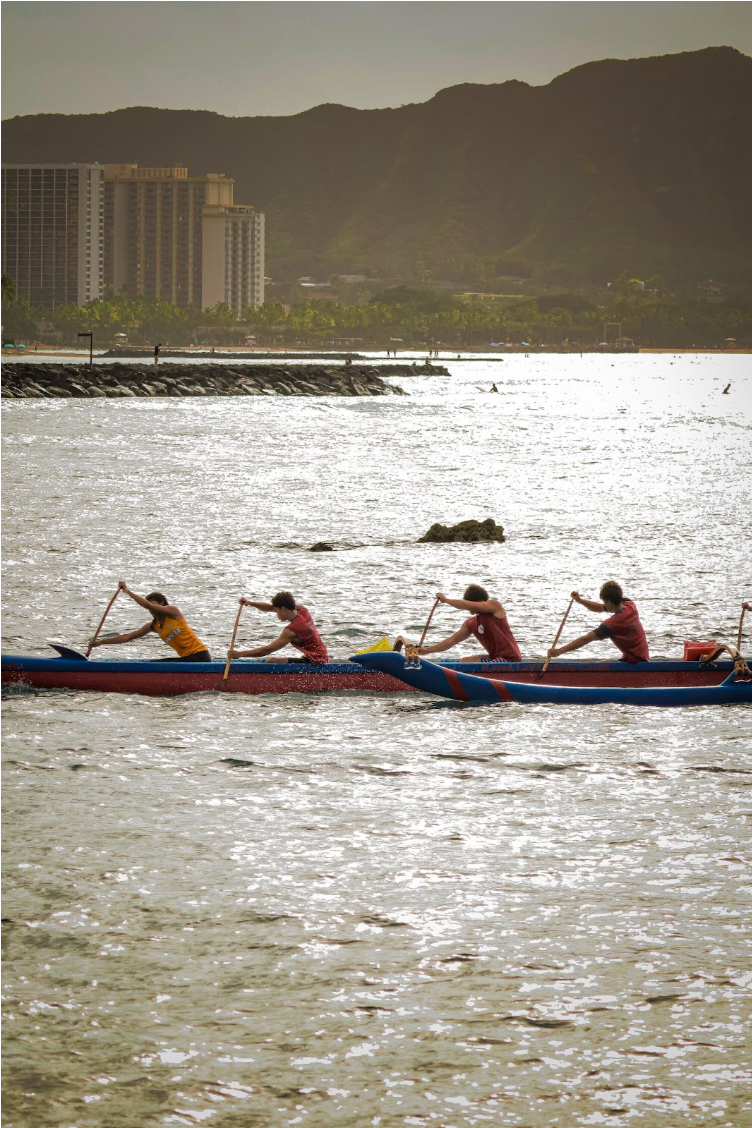 The crew finishing up their race, all in sync as they push to the finish line 
(Laule’a Meyer ‘26, Noah Ishida ‘26, Kahua Mersberg ‘26, Gabriel Ahana ‘27)
