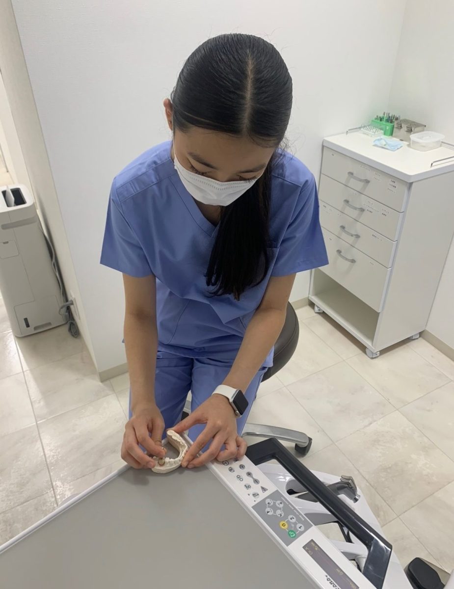 Senior Riona Nakase works on a crown prototype for an implant restoration during a 2025 summer internship at a dental clinic in Tokyo, Japan. After finding a few dentistry-related organizations at SHA, Nakase sought out professionals in the field to explore an interest in dentistry. Photo courtesy of Riona Nakase.